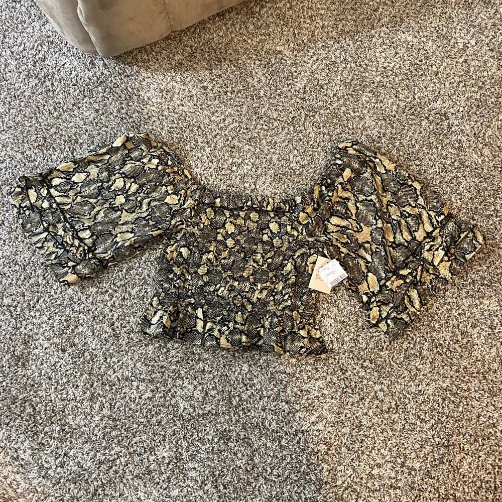 Snake skin pattern off the shoulder ruffle top.